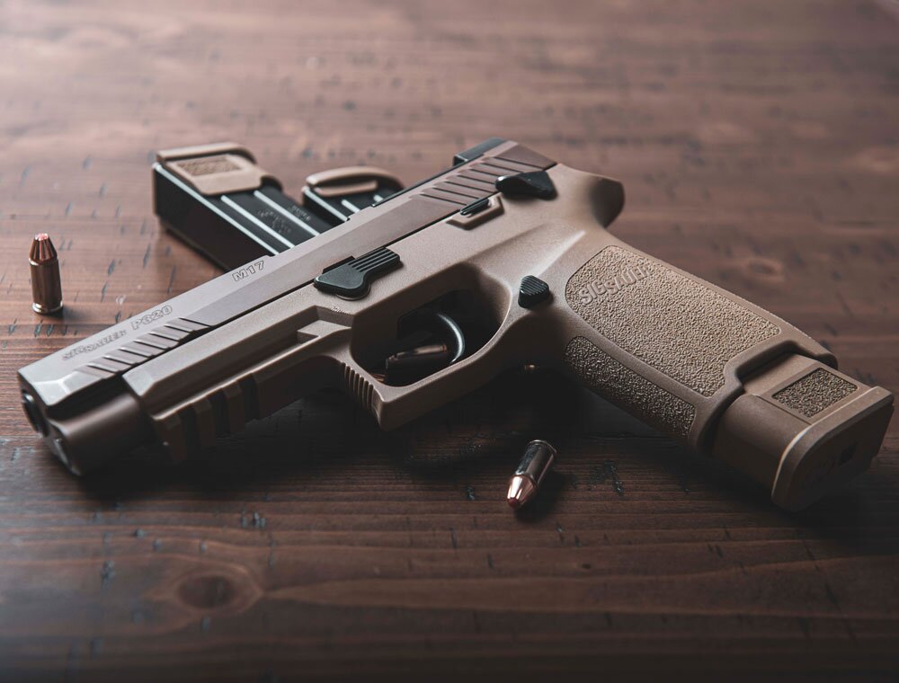 black-and-silver-semi-automatic-pistol-on-brown-wooden-table-3602944